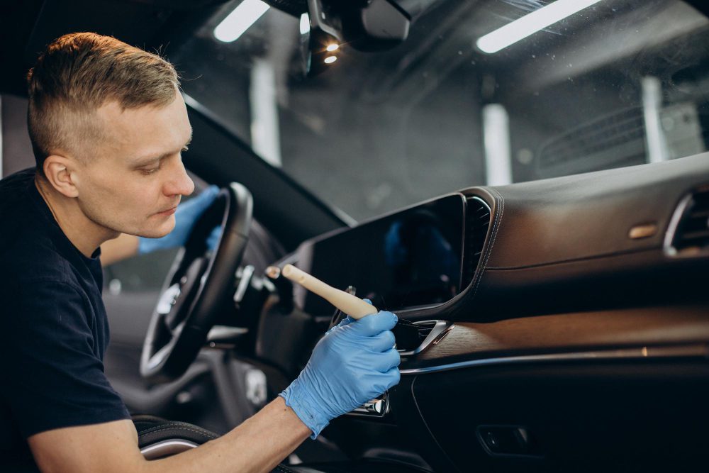 man-car-clean-using-brush-clean-up-all-details-inside-vehicle-1.jpg